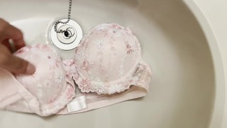 Pissing to a pink bra with a cute design.