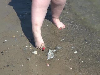 A Fat Woman with BigFeet Walks Along the_Shore.