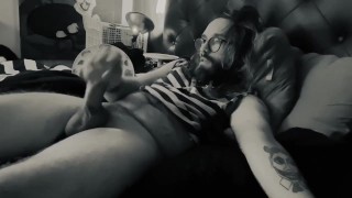 Bearded Daddy with glasses strokes thick cock