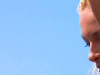 While having anal sex with the blonde milf he holds her by her fake boob