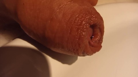 Close up pee. Uncut foreskin 