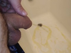 Guy pissing in the bath