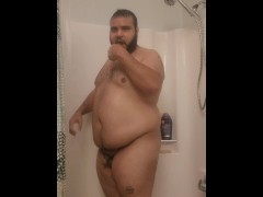 Fat arab showing off body in shower 