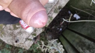 Uncut cock cumshot from a bridge close up