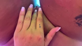 Playing with wet pussy while tanning