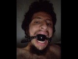Gagged boy spitting in himself while wanking his big cock