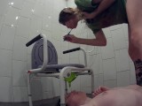 Using a slave as a spittoon for brushing teeth