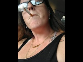 Nerdy MILF Smoking Cigarettes in Truck