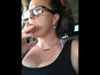 Nerdy Milf Smoking Cigarettes Showing Cleavage In Truck