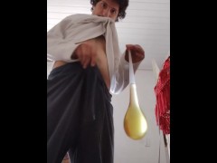 Filling a condom with piss video tape on old house