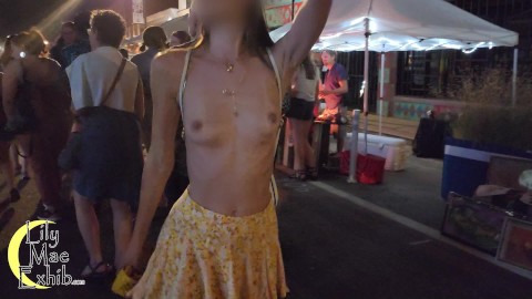 Going totally topless and flashing pussy at the street festival!