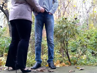 Gorgeous MILF in a business suit holds my cock while I pee