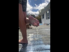 Naughty bbw pours milk on feet and soles outdoors