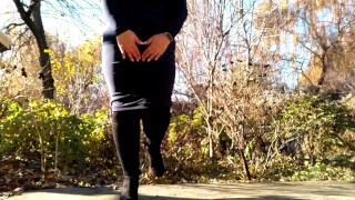 Sexy MILF in long skirt and boots pissing outdoors rear view