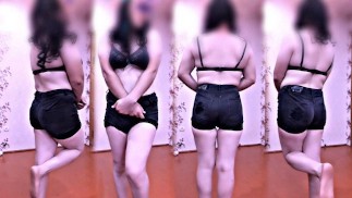 Черные джинсовые шорты, черный бюстгальтер и симпатичная стройная модель косплеера-транссексуала