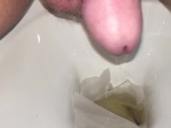 Pissing into toilet