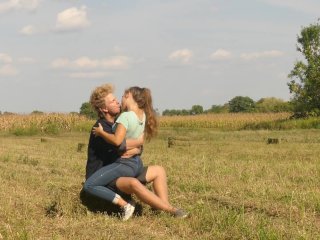 Beautiful Teen Couple in_Love Passionately KissingOn the Field