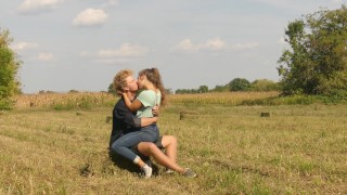 Beautiful Teen Couple In Love Kissing Passionately On The Field