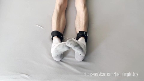 Short white sport socks on cuffed foots