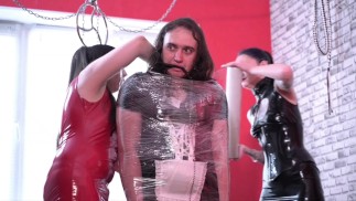 Two Mistresses tied up their maid with cling film and tickled her feet. Tickling, immobilization.
