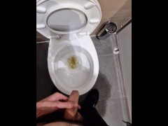 Guy peeing in the public toilets during work time | 4K