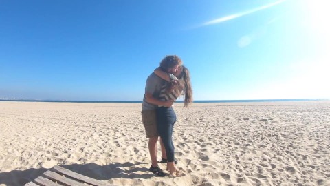 Hot teen couple in love kissing on a sandy beach