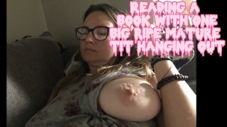 Caught this MILF reading a book with one BIG RIPE TIT hanging out, OOPS