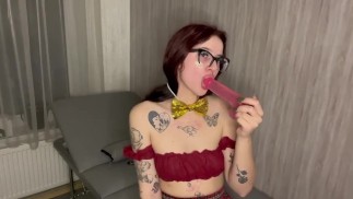Having fun with his rubber dick, sucking deep.