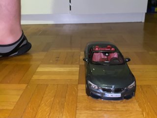 Playing with a BMW M4 cabrio toy car