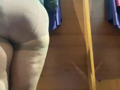 Curvy MILF in the mall fitting room trying on skirts