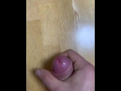 Slow motion cumshot on the table