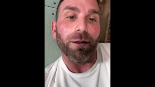 Construction worker solo male masturbation on job site.