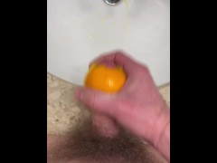 Using an orange as a fuck toy