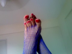 Fucking machine while in blue fishnets and long red toenails