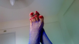 Fucking machine while in blue fishnets and long red toenails