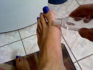 Oilying long blue toenails and feet