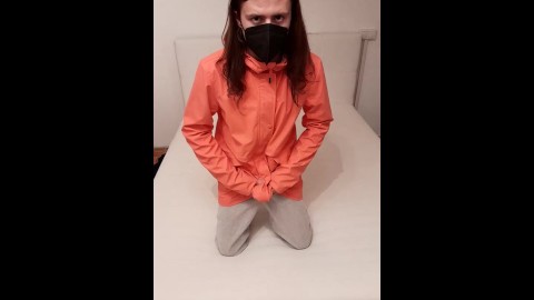 Sissy masturbates in pink raincoat