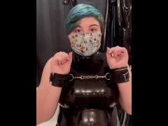 Girl in latex cuffs herself