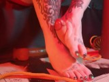 Rubbing a rubber cock with my tattooed hands and feet