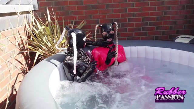 Lesbian Latex Lovers Play in the Hot tub