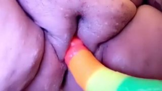 Rainbow dildo with creamy pussy