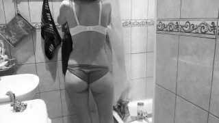 Slim MILF small tits and big booty washes and pees in the shower.