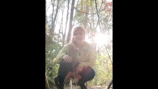 Peeing girl in the forest