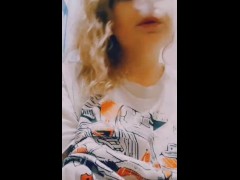 Redhead smokes and touches her tits