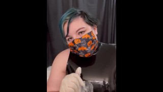 Girl in latex plays with cum