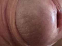 Pulling back foreskin close up