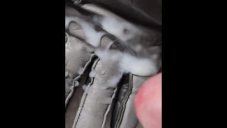 Cumming on a grey leather glove