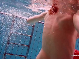 Adorable brunette teen swimming naked