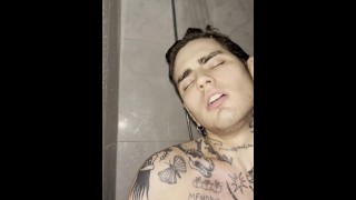 Tattooed young guy jerking off in the shower