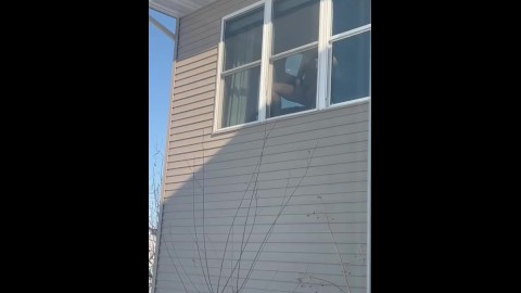 Public Masturbation: sexy horny MILF gets caught by neighbors masturbating in window with big dildo.